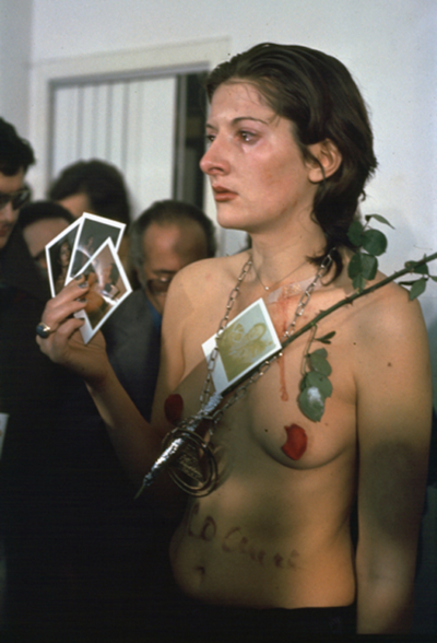 Rhythm 0 (1974) by Marina Abramović